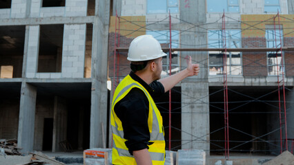A construction foreman conducts an inspection at a construction site
