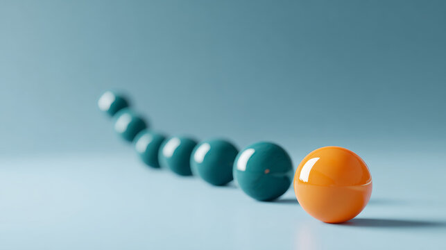 Orange sphere standing out in front of a row of blurred teal spheres on a smooth blue surface with soft lighting - Powered by Adobe