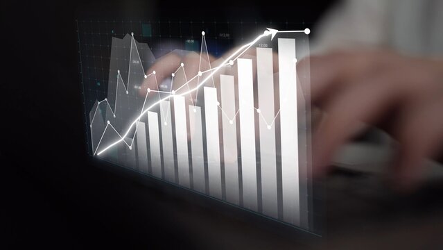 This image showcases a hand typing on a keyboard with an overlay of graphs and charts, symbolizing data analysis and business growth in a modern workspace. Copula
