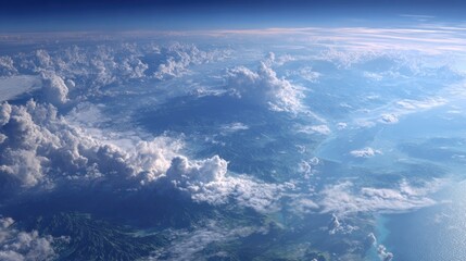 Aerial View of Cloud Cover Over Mountainous Landscape and Water Bodies from High Altitude