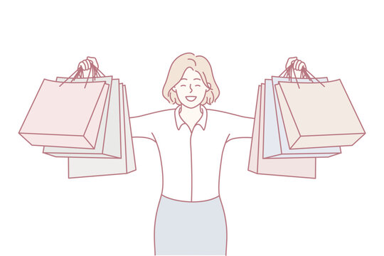 Woman gleefully displaying her vibrant collection of shopping bags in mall, Joyful female shopper showcasing her multiple vividly colored shopping bags amid bustling retail environment
