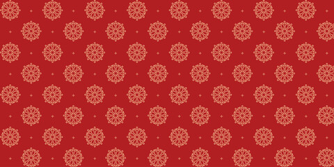 Elegant seamless pattern with golden snowflakes and tiny stars on a rich red background, perfect for Christmas wrapping paper, festive textiles, greeting cards, invitations and seasonal holiday design