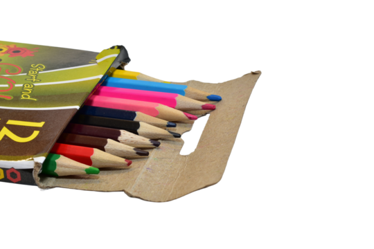 Colored pencils in a cardboard box lie on a PNG background.