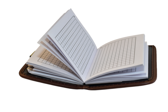 A notepad lies open on a white background.