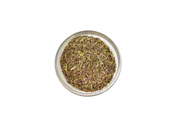 Dry, ground mint lies in a round container. Top view.