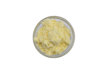 Powdered dry cream in a round bowl. Top view.