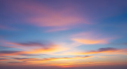 Obraz premium Vibrant Sunset Sky with Pastel Pink Orange and Blue Clouds at Twilight