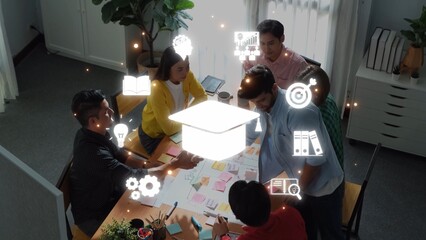 A diverse team engages in a dynamic brainstorming session at a conference table, surrounded by elements symbolizing education and innovation, fostering collaboration and growth. Raster