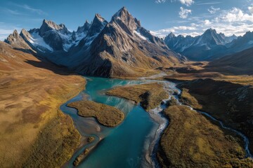 Majestic Mountain Vista: An awe-inspiring aerial perspective of a breathtaking mountain range, showcasing towering peaks, a winding river, and a vibrant landscape under a clear sky.