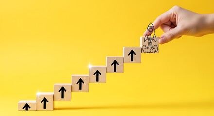 Hand placing a wooden block with a figure on top of a staircase of blocks