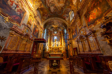 Obraz premium Baroque church interior in Nitra, Slovakia featuring gilded altarpiece
