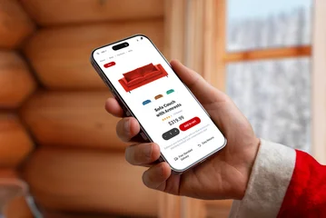 Fotobehang Muziek Santa holding smartphone with online furniture store screen in cozy winter interior, ideal for ecommerce themes, shopping promotions, holiday marketing and digital retail concepts  © Stanisic Vladimir