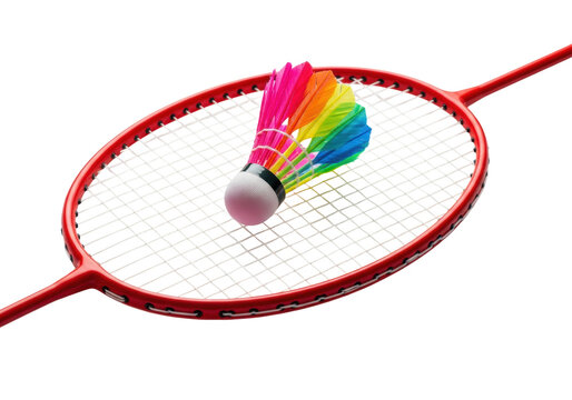 A vibrant red professional badminton racket with taut white strings and a rainbow shuttlecock, isolated on a flawless white studio background, creating copy space. concept of active recreation and