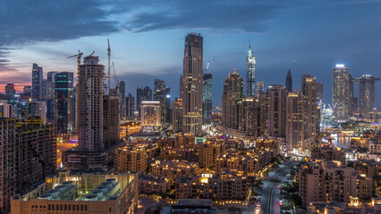 Obraz premium Dubai Downtown skyline during sunset timelapse with modern towers panoramic view from the top in Dubai