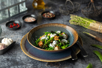 Fresh asparagus and pea salad with chicken and yogurt