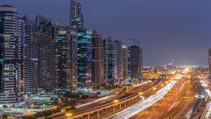 Obraz premium Aerial top view to Sheikh Zayed road near Dubai Marina and JLT day to night timelapse, Dubai.