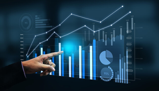 A business professional engages with a digital screen, analyzing graphs and charts that represent data trends in a modern office setting, showcasing technology and strategy. Scalp