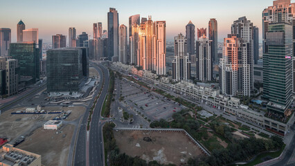 Panorama of Business bay Dubai night to day aerial timelapse.
