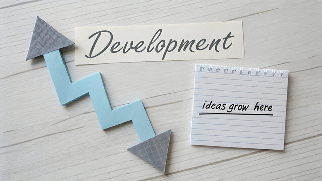 Arrow pointing upward with Development concept and ideas