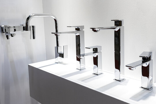 Stainless steel sink faucets on display for sale in the booth