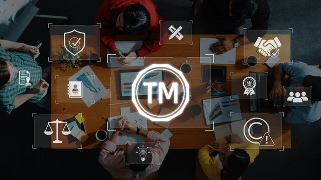 A dynamic business meeting setup highlighting collaboration and technology, featuring digital icons related to brand management and teamwork, fostering innovation and strategy. Raster