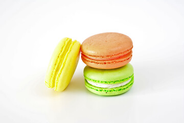 Colorful French Macarons Stacked on a White Background