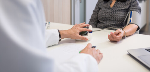 Blood pressure health check , High Blood Pressure check blood pressure of a patient in hospital, selective focus, shallow DOF