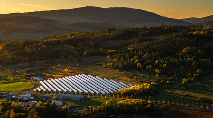 Solar Power Plant in Scenic Countryside Landscape at Sunset