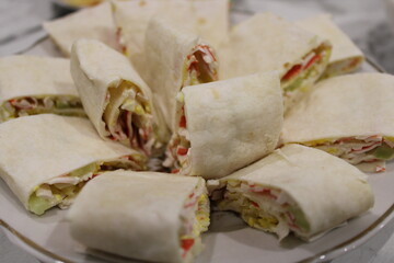 Wraps arranged beautifully on a plate for a gathering or party at home in the evening