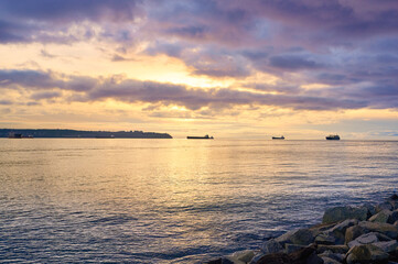 Fototapeta premium Sunset over the sea. Burrard Inlet. View from West Vancouver. British Columbia, Canada