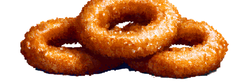 Golden fried onion rings stacked close up