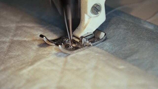 Sewing machine in action as it creates beautiful patterns on fabric in a cozy workshop setting during the afternoon
