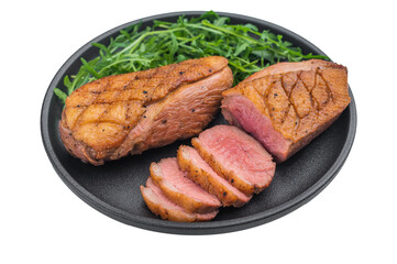 Gourmet roasted duck breast arranged with greens on dark plate against clean grey surface great for cooking blogs and stock photography.