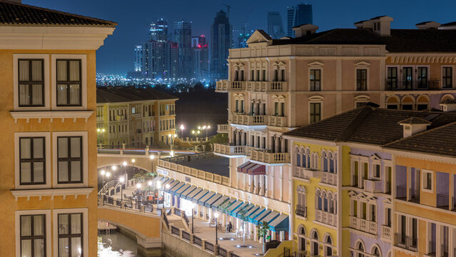 Canal aerial top view in Venice-like Qanat Quartier of the Pearl precinct of Doha day to night timelapse, Qatar.