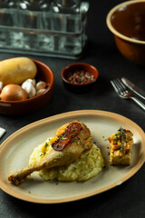 Crispy chicken leg with mashed potatoes and chorizo