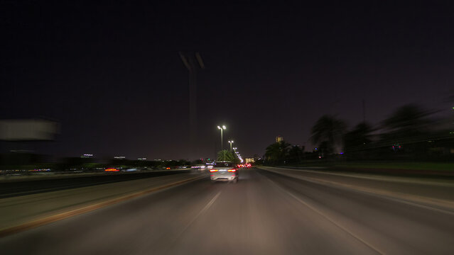 Drive through the traffic in the city highway timelapse hyperlapse in Kuwait. Kuwait, Middle East - Powered by Adobe