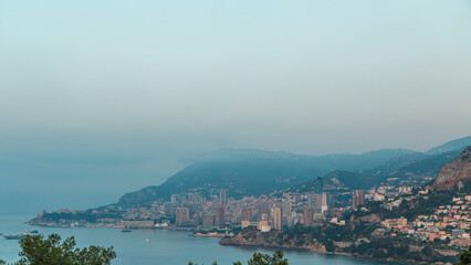 Fototapeta premium Cityscape of Monte Carlo night to day timelapse, Monaco before summer sunrise.