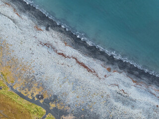 Aerial view of a coastline scenery with black beach in Iceland