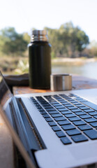 Digital Nomad Lifestyle: Working Remotely on a Laptop by the Lake
