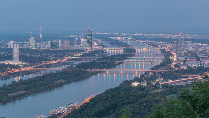 Fototapeta premium Skyline of Vienna from Danube Viewpoint Leopoldsberg aerial day to night timelapse.