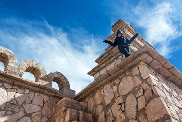 San Cristobal Church stands in the open high desert village near Uyuni, Bolivia, framed by an expansive landscape and quiet surroundings.
