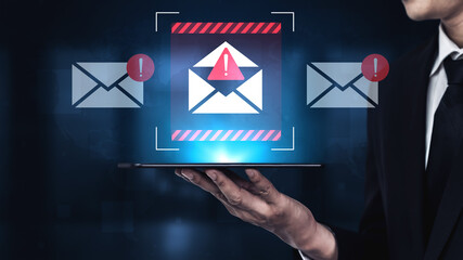 A conceptual image showing a hand holding a tablet displaying a security alert for emails, emphasizing concerns about digital privacy and communication risks. Gantry