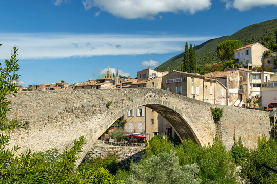 Nyons Roman bridge spanning Eygues river, Provence village