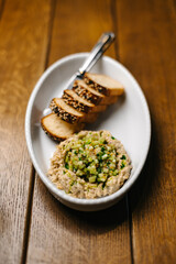 Tuna spread with cucumber relish and toasted bread top view