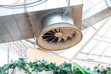 The photograph displays an industrial ventilation system. Industrial