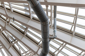 The photograph displays an industrial ventilation system. Industrial