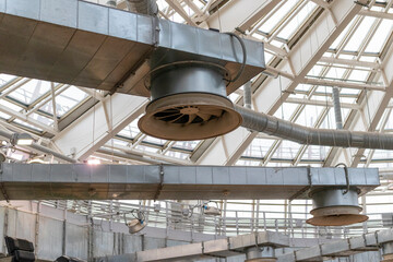 The photograph displays an industrial ventilation system. Industrial