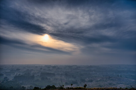 HDR images of an early morning forest surrounded by fog with a sunrise view