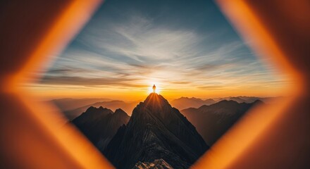 Lone hiker reaches mountain peak at sunrise