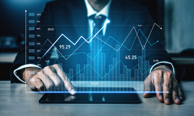 A business analyst engages with a digital tablet, analyzing financial graphs and metrics in a modern office setting, showcasing data trends and insights. Scalp